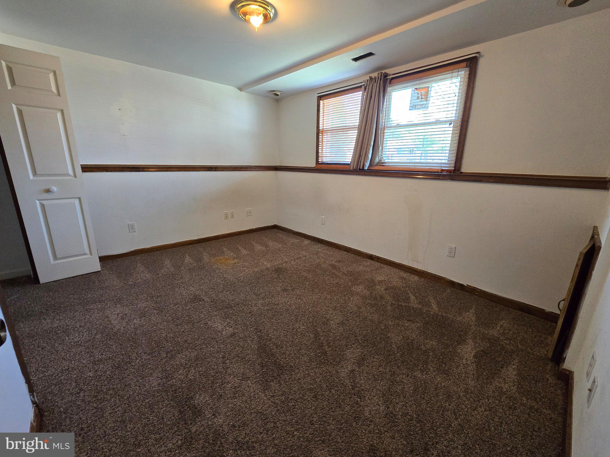 5040 Clifford Road, Unit 5040 Perry Hall, MD 21128 - Photo 18 of 19 an empty room with windows