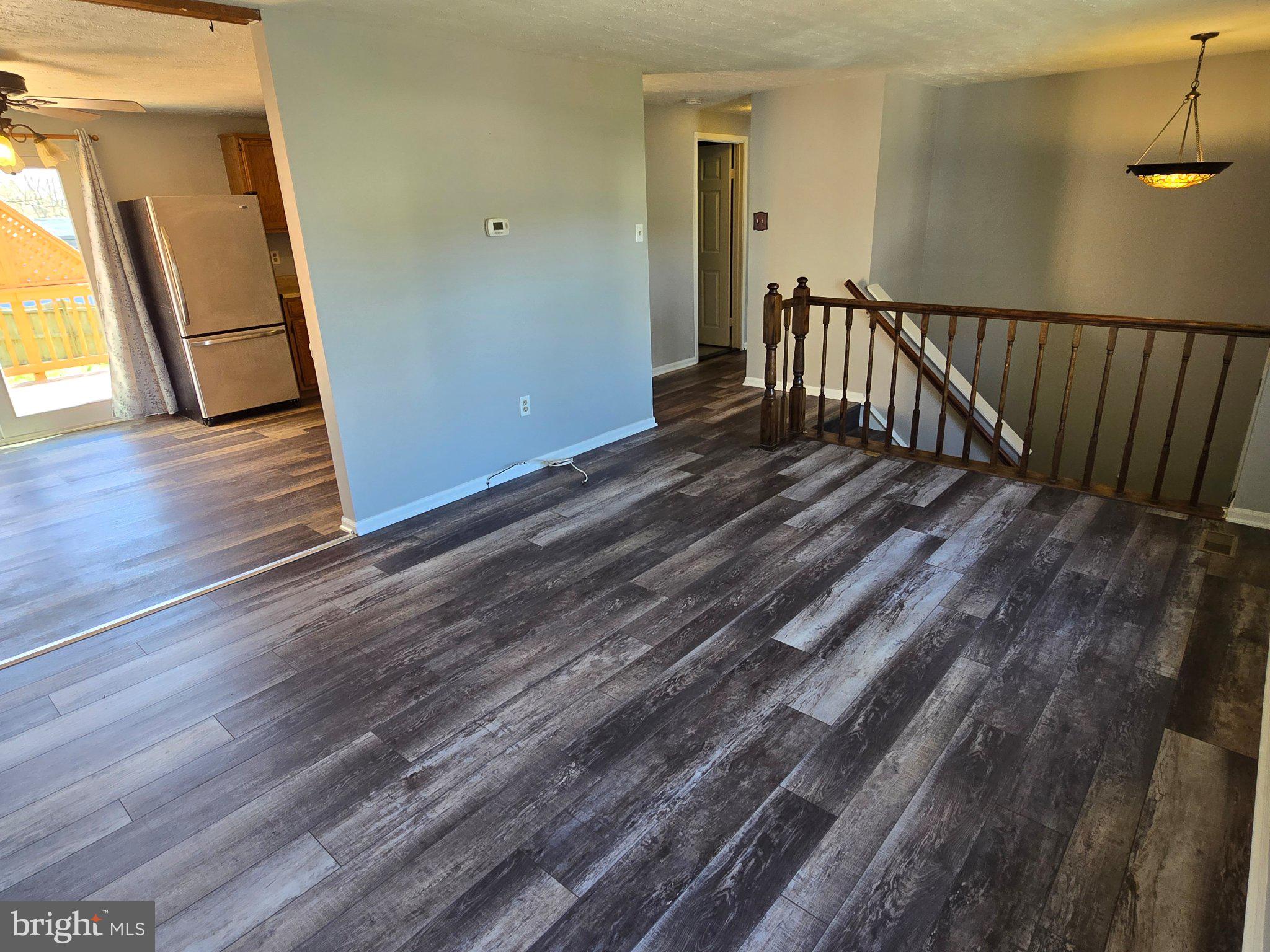 5040 Clifford Road, Unit 5040 Perry Hall, MD 21128 - Photo 5 of 19 a view of a hallway with wooden floor