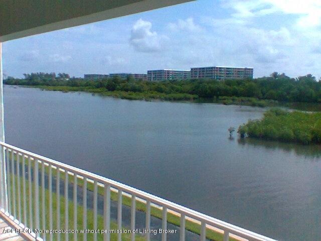 2195 Ibis Isle Road, Unit 5 Palm Beach, FL 33480 - Photo 3 of 12 a view of lake with green space