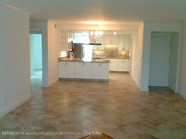 2195 Ibis Isle Road, Unit 5 Palm Beach, FL 33480 - Photo 8 of 12 a large bathroom with a glass door shower and a sink