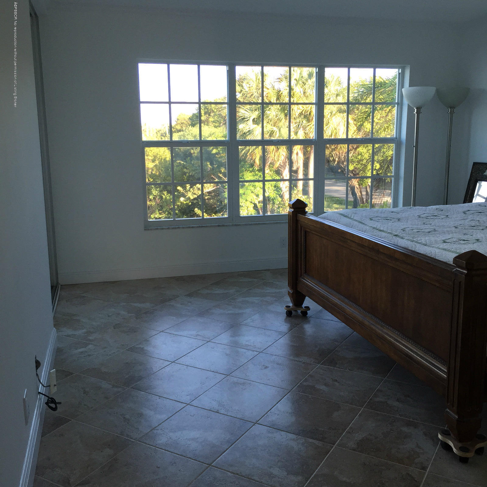 2195 Ibis Isle Road, Unit 5 Palm Beach, FL 33480 - Photo 9 of 12 a living room with a large window