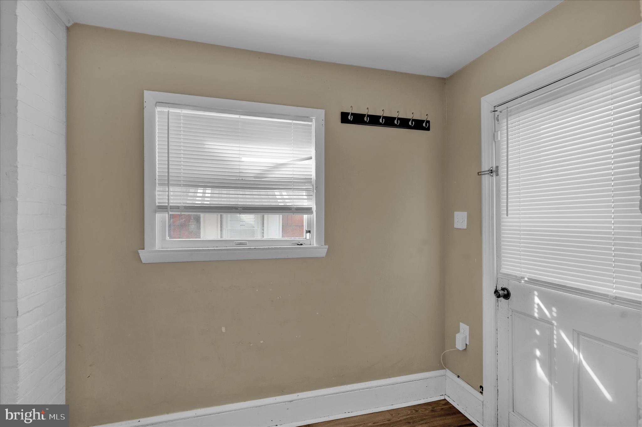 715 Mount Laurel Road Temple, PA 19560 - Photo 11 of 24 a view of an empty room with wooden floor and a window