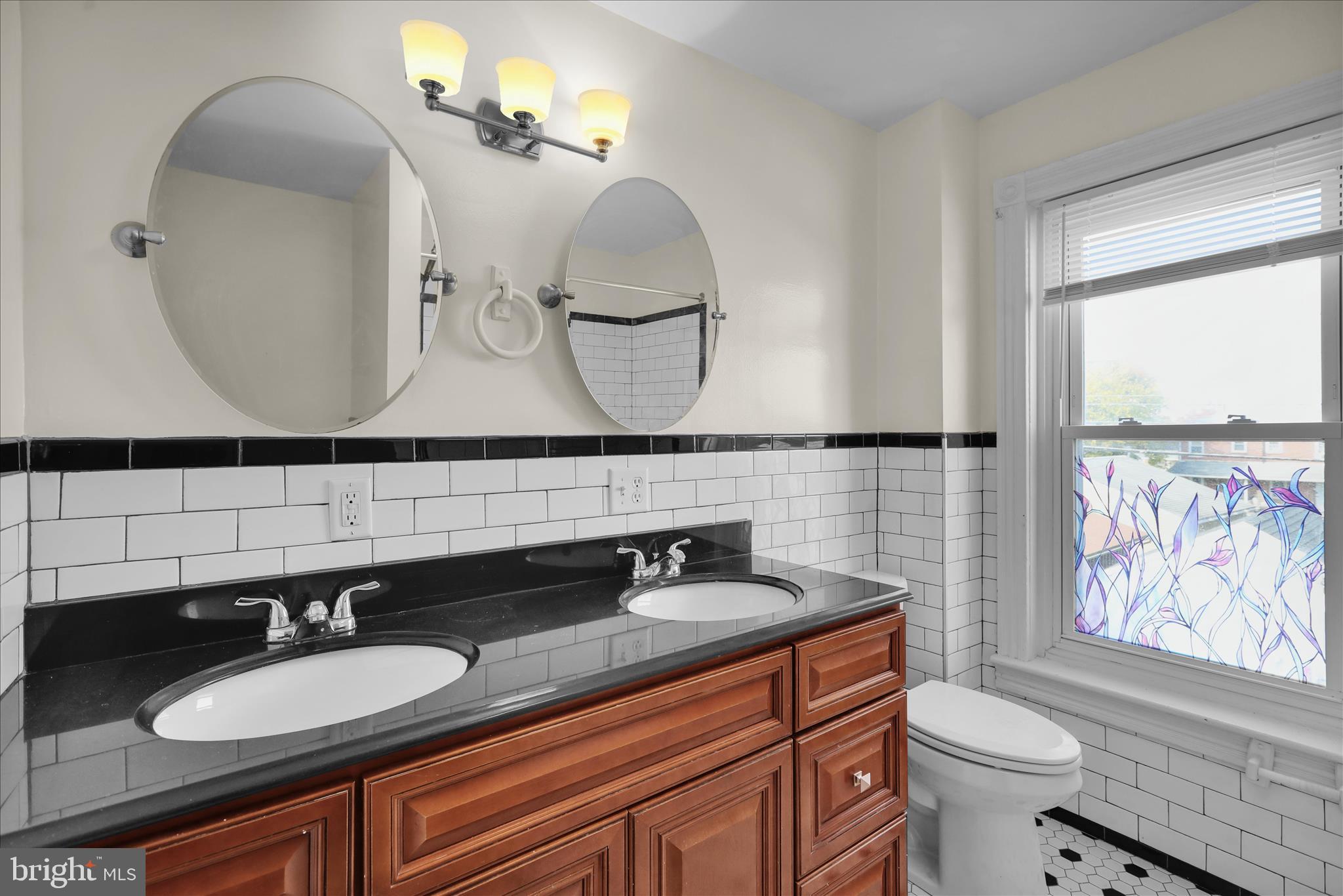 715 Mount Laurel Road Temple, PA 19560 - Photo 12 of 24 a bathroom with a granite countertop toilet sink and mirror