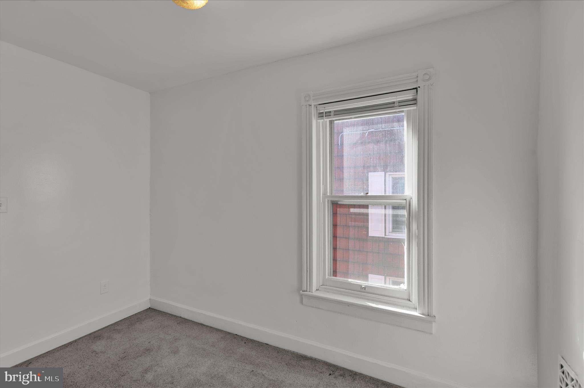 715 Mount Laurel Road Temple, PA 19560 - Photo 16 of 24 a view of an empty room with a window