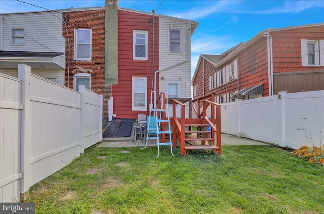 front view of brick house with a yard