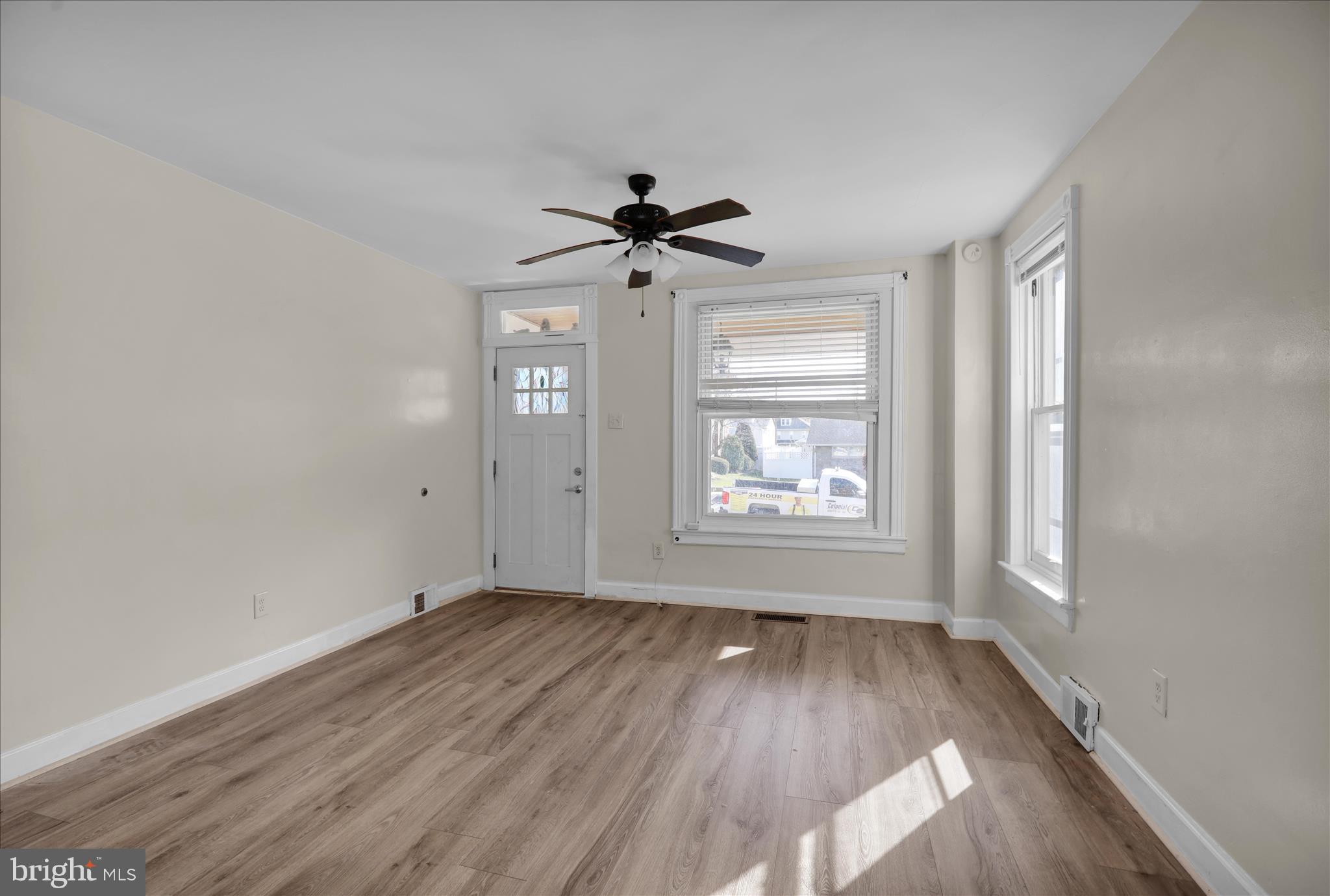 715 Mount Laurel Road Temple, PA 19560 - Photo 5 of 24 wooden floor in an empty room with a window