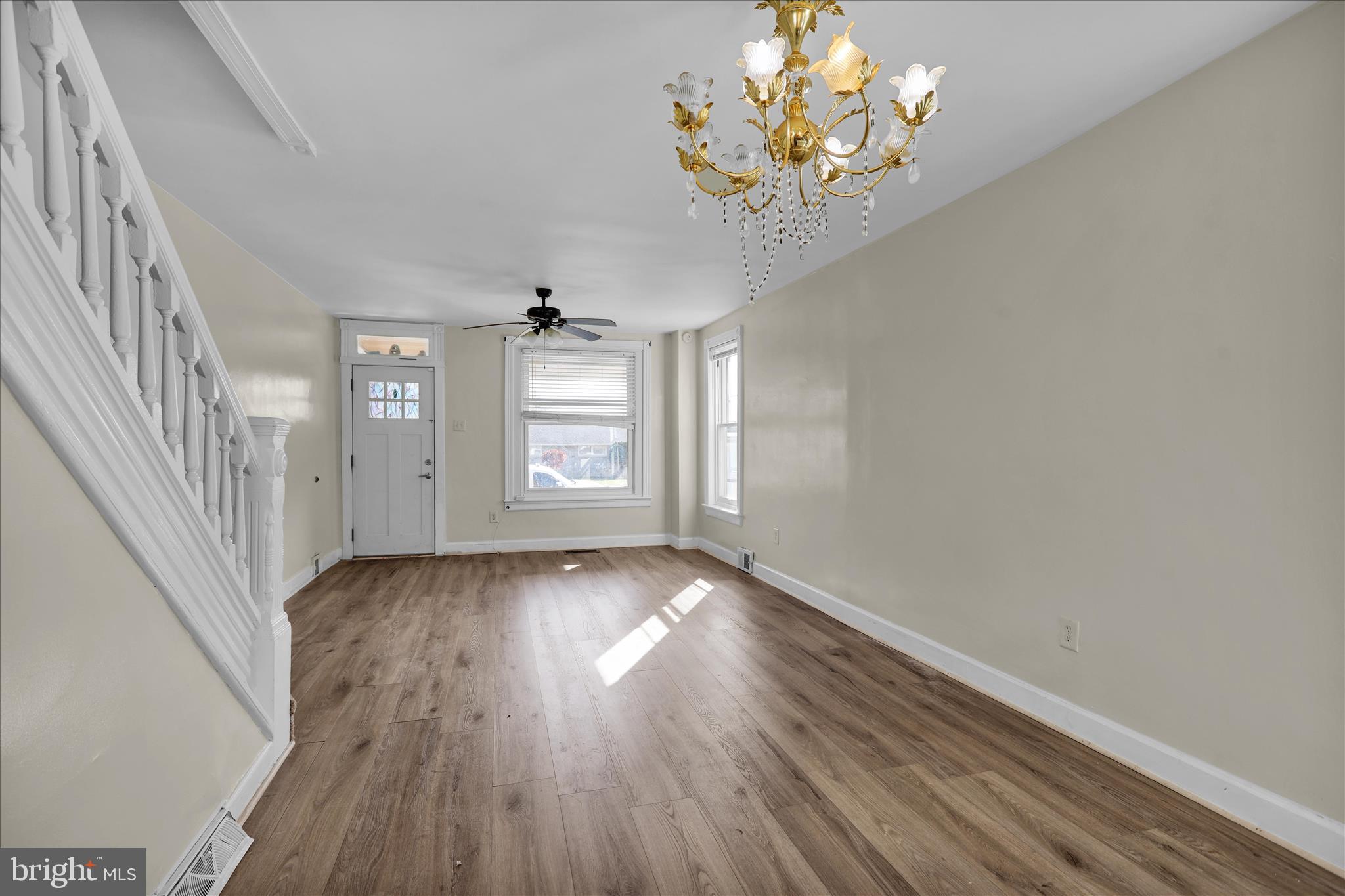 715 Mount Laurel Road Temple, PA 19560 - Photo 6 of 24 a view of an empty room with wooden floor and a window