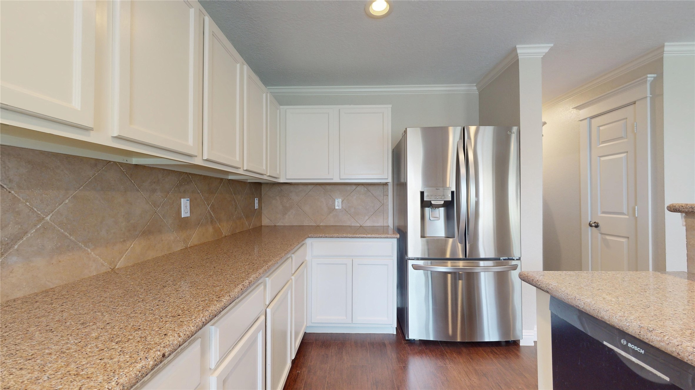 7918 Tupper Bend Court Cypress, TX 77433 - Photo 15 of 49 a kitchen with a refrigerator and a sink