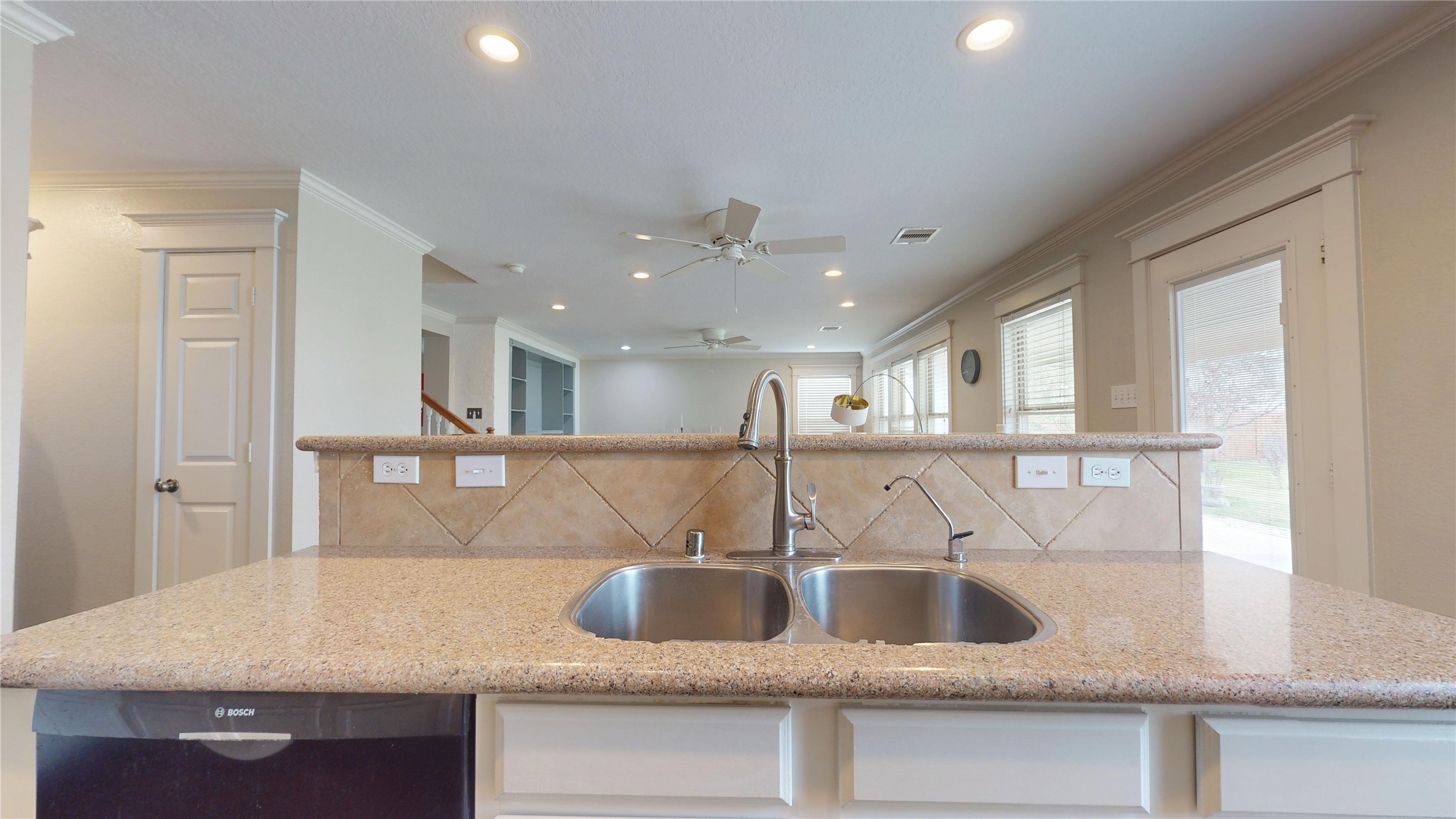 7918 Tupper Bend Court Cypress, TX 77433 - Photo 16 of 49 a kitchen with kitchen island a sink and a refrigerator