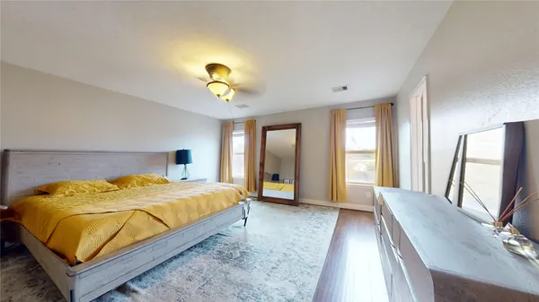 a bedroom with two beds and painted walls