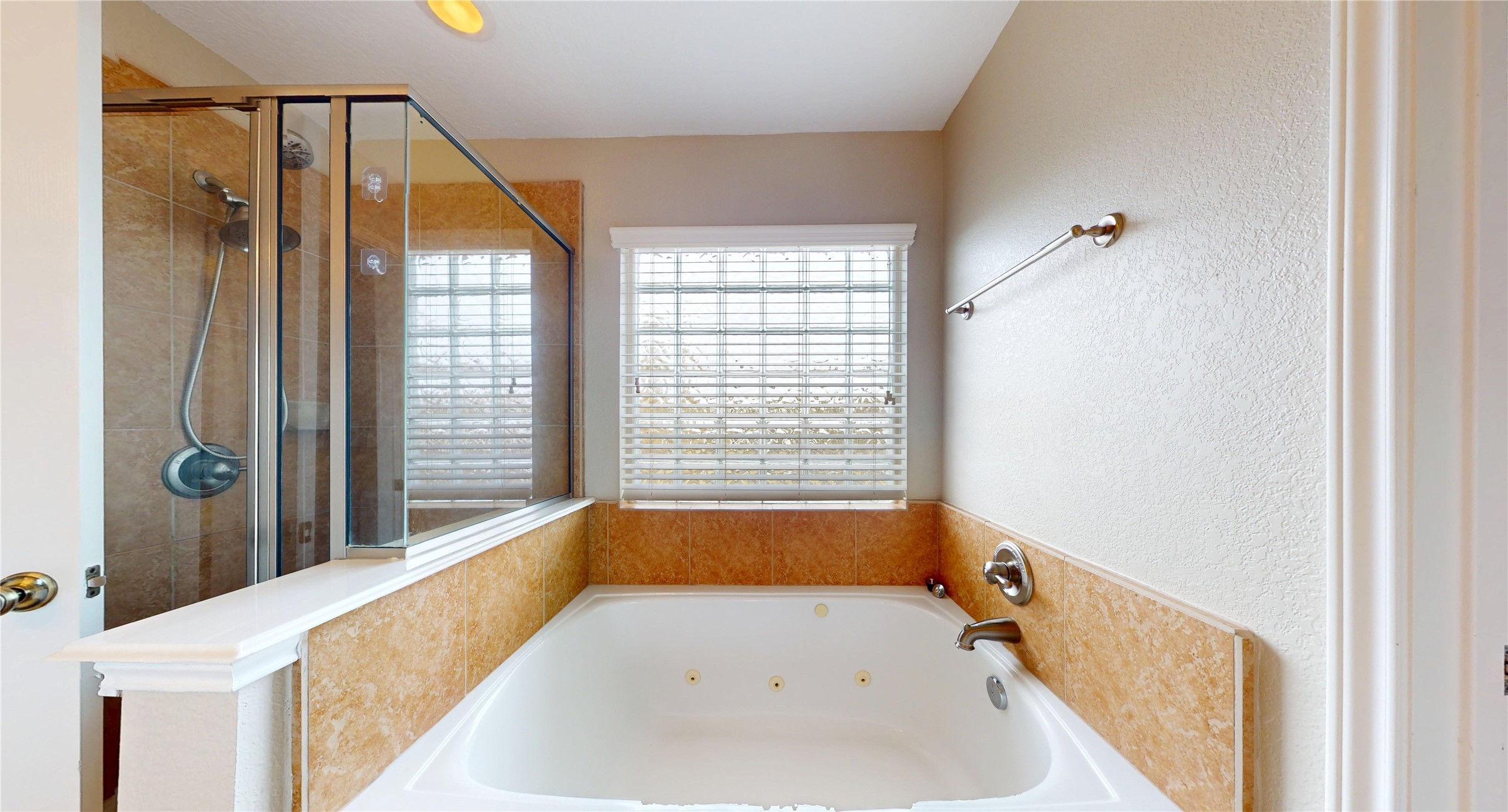 7918 Tupper Bend Court Cypress, TX 77433 - Photo 30 of 49 a bathroom with a tub and a window