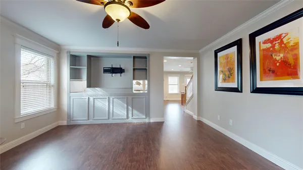 a view of an entryway with wooden floor