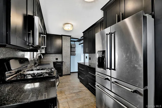 a kitchen with a refrigerator and a sink