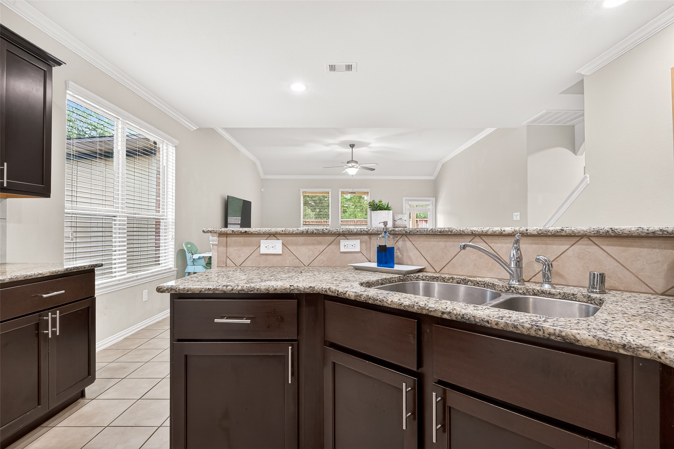 8 Landscape Court Conroe, TX 77301 - Photo 18 of 43 a kitchen with granite countertop a sink and a granite counter tops
