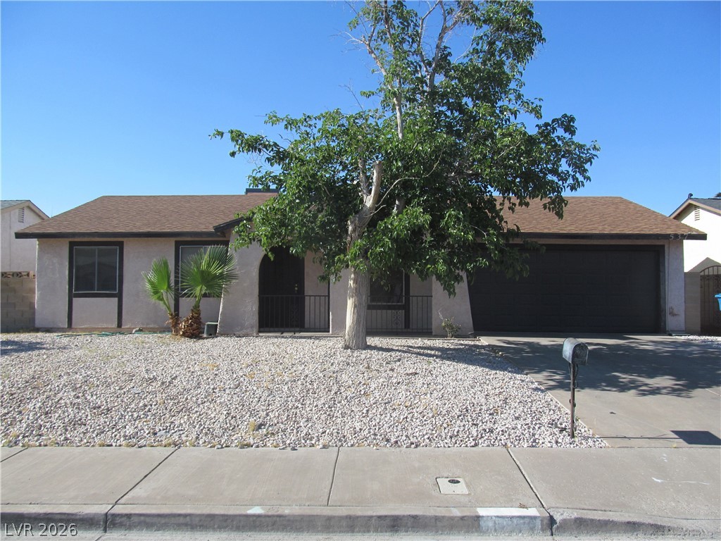This charming home offers a simple facade and convenient attached garage.