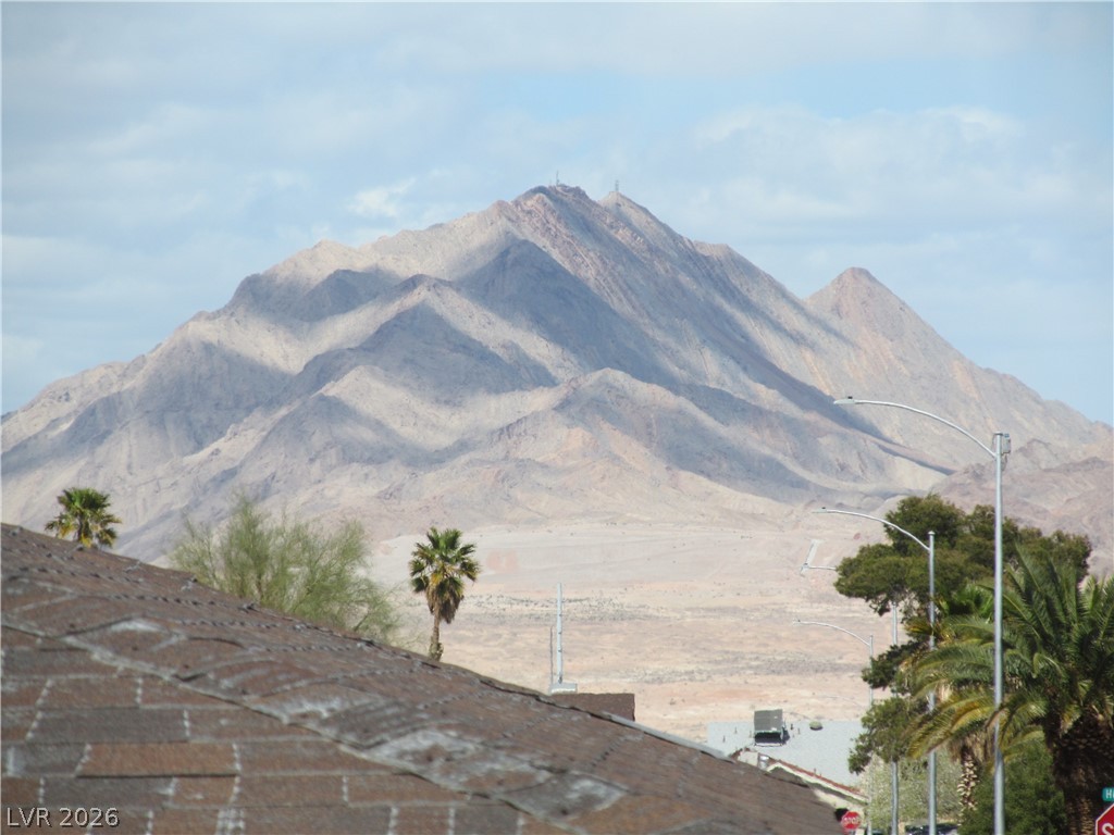 537 Longtree Avenue Henderson, NV 89011 - Photo 29 of 31 Dramatic mountain range view from this property, offering a serene desert landscape.