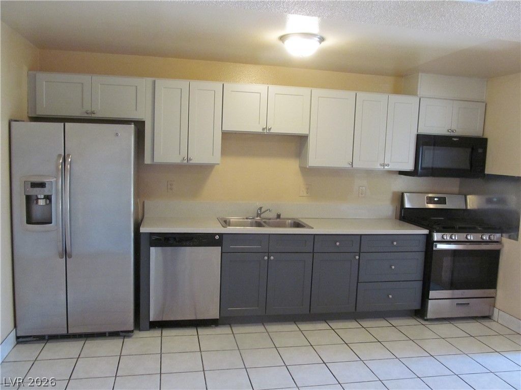 537 Longtree Avenue Henderson, NV 89011 - Photo 5 of 31 This functional kitchen offers ample storage and modern appliances for everyday living.