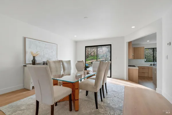 a view of a dining room with furniture and a livingroom