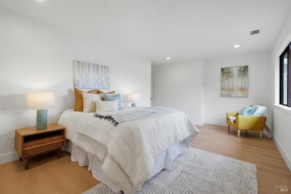 a bedroom with bed and window