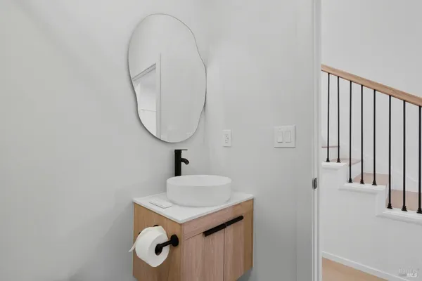 a bathroom with a sink and a mirror