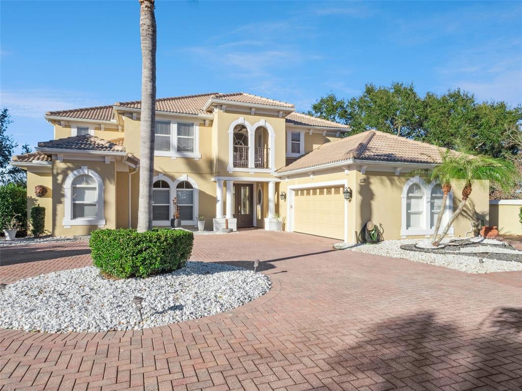 2500 St Ignatius Court Orlando, FL 32835 - Photo 61 of 71 a front view of a house with a garden