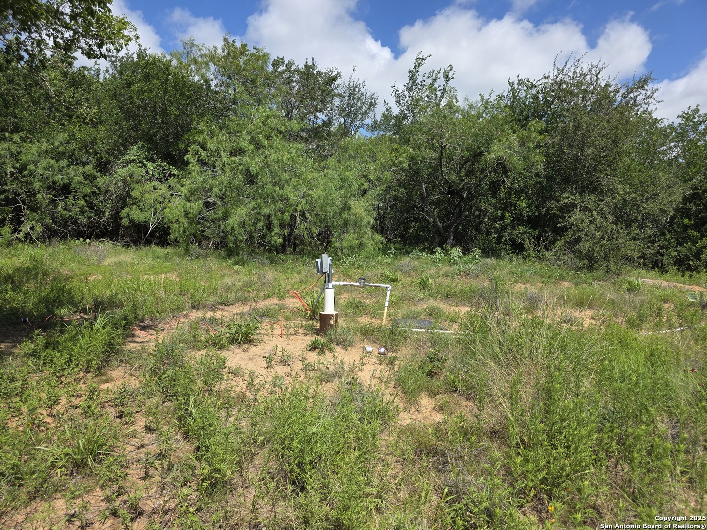 525 Marrou Road Seguin, TX 78155 - Photo 3 of 14 a backyard of a house with a yard and outdoor seating