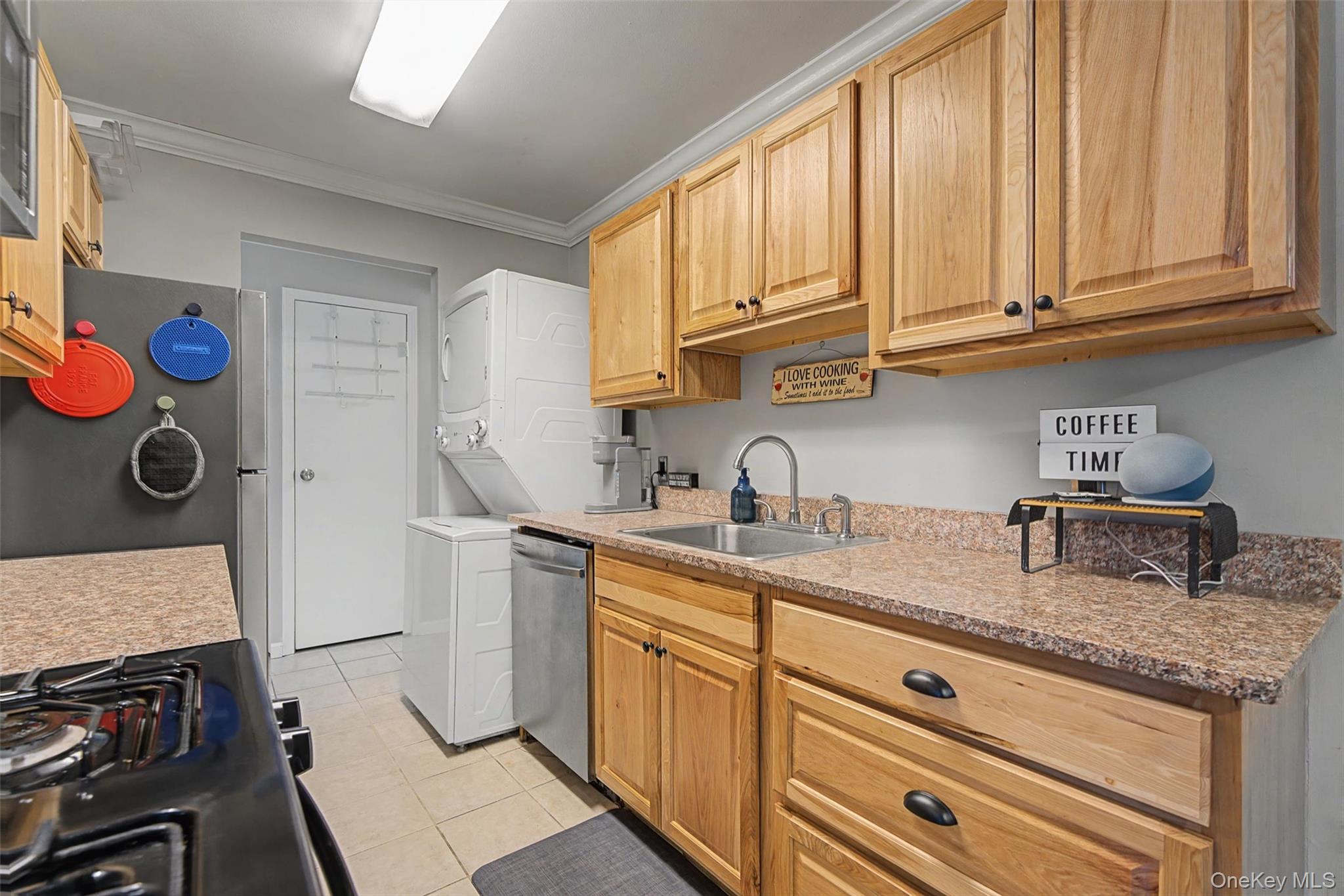 276 Temple Hill Road, Unit 1117 New Windsor, NY 12553 - Photo 12 of 24 a kitchen with stainless steel appliances granite countertop a sink stove and cabinets