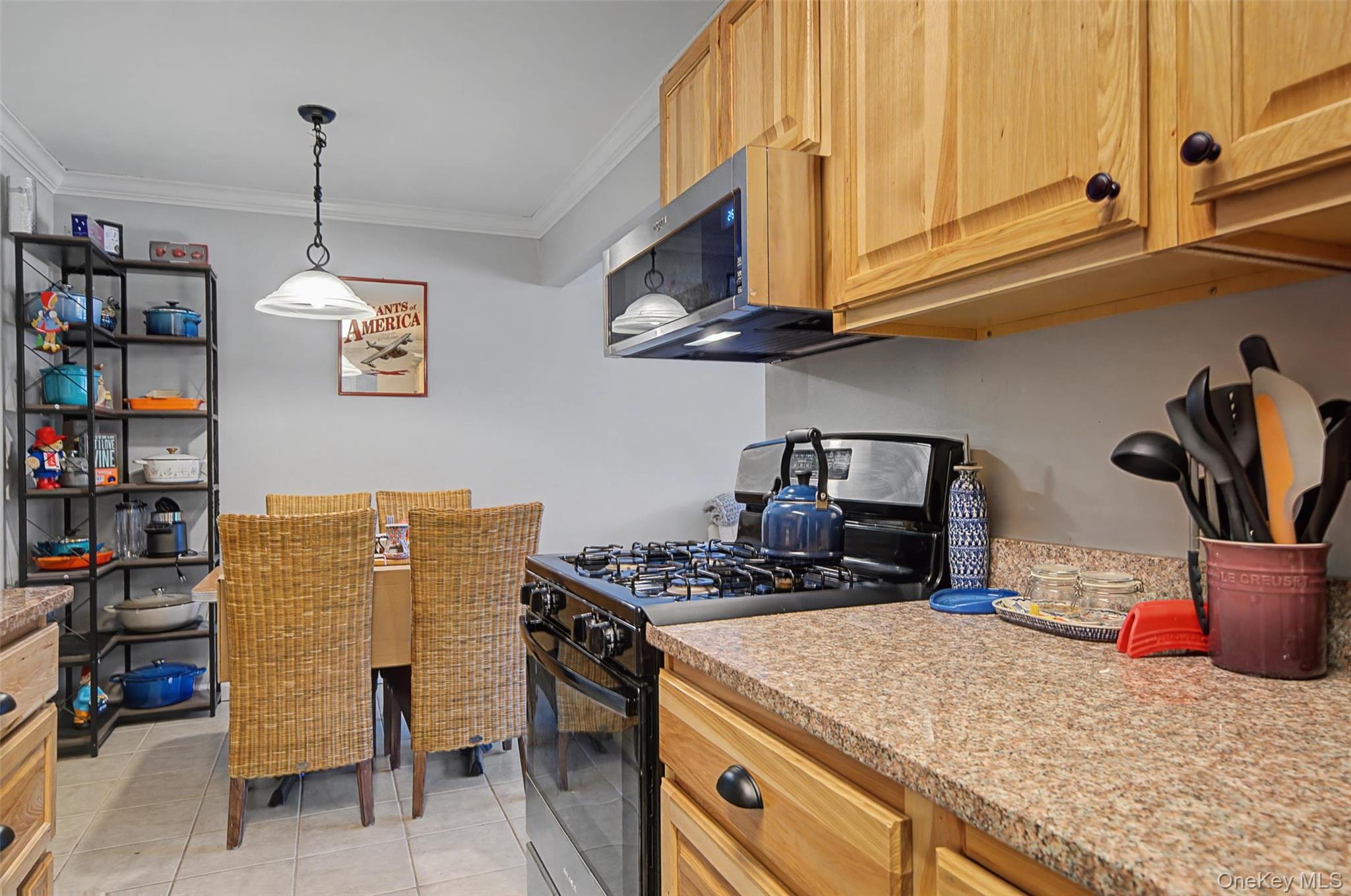 276 Temple Hill Road, Unit 1117 New Windsor, NY 12553 - Photo 16 of 24 a kitchen with stainless steel appliances granite countertop a stove and a white cabinets