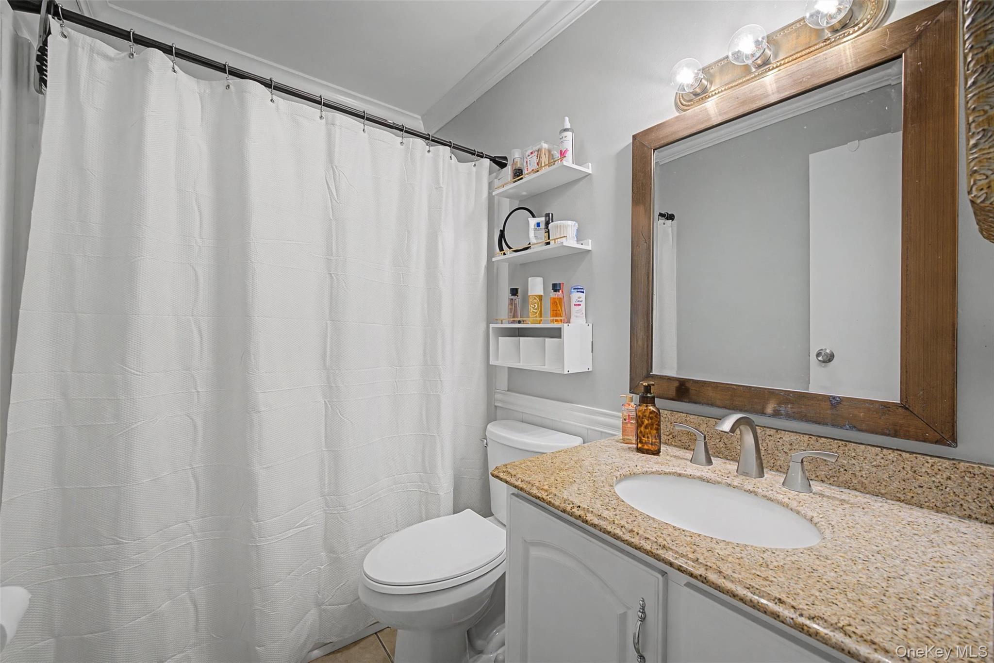276 Temple Hill Road, Unit 1117 New Windsor, NY 12553 - Photo 19 of 24 a bathroom with a granite countertop sink and a mirror
