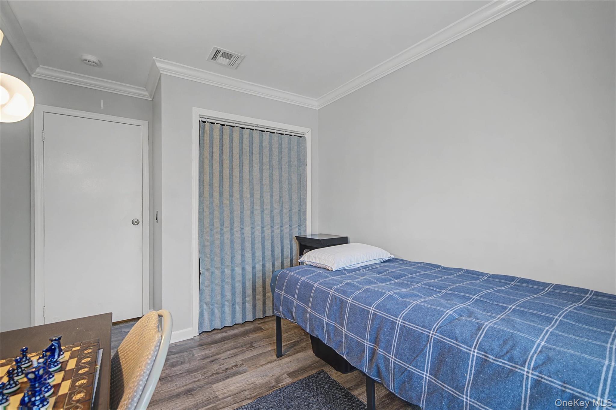 276 Temple Hill Road, Unit 1117 New Windsor, NY 12553 - Photo 21 of 24 a bedroom with a bed and a window