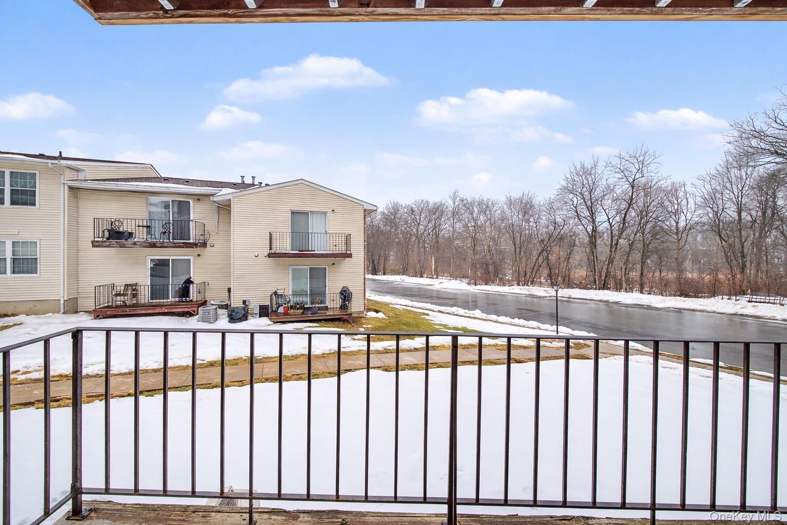 276 Temple Hill Road, Unit 1117 New Windsor, NY 12553 - Photo 22 of 24 a view of a houses with a balcony