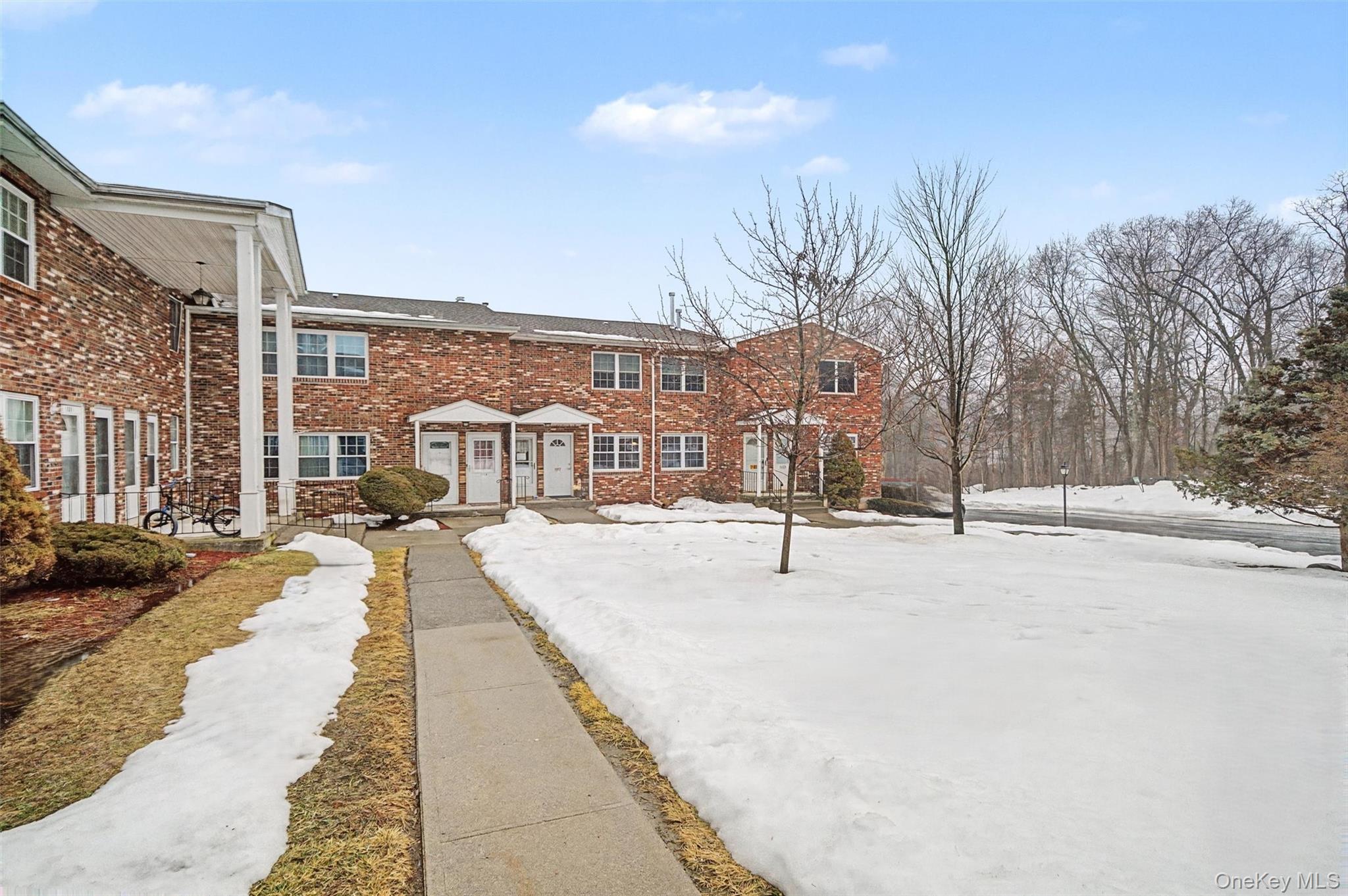 276 Temple Hill Road, Unit 1117 New Windsor, NY 12553 - Photo 23 of 24 a view of a house with snow on the road