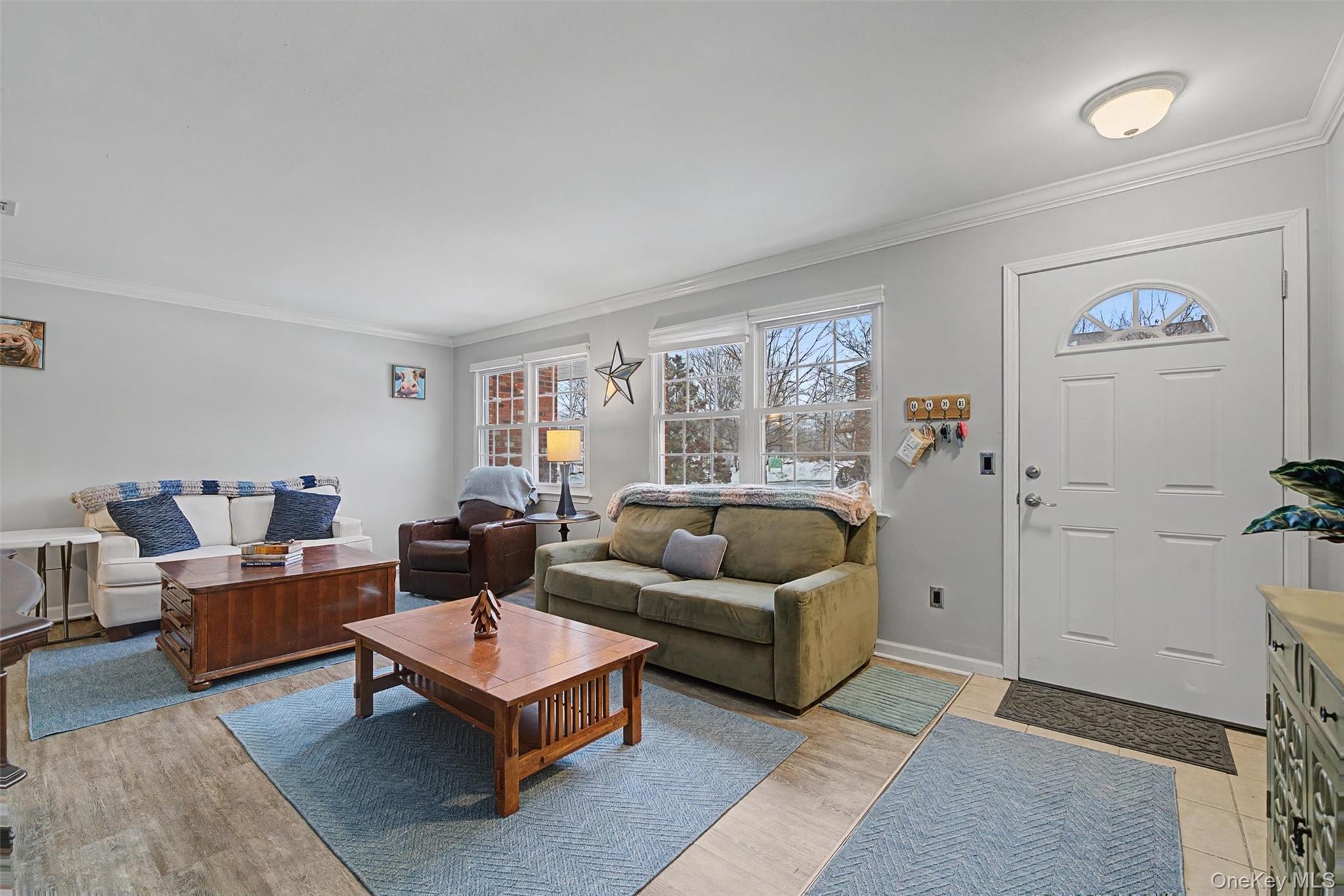 276 Temple Hill Road, Unit 1117 New Windsor, NY 12553 - Photo 4 of 24 a living room with furniture and a large window