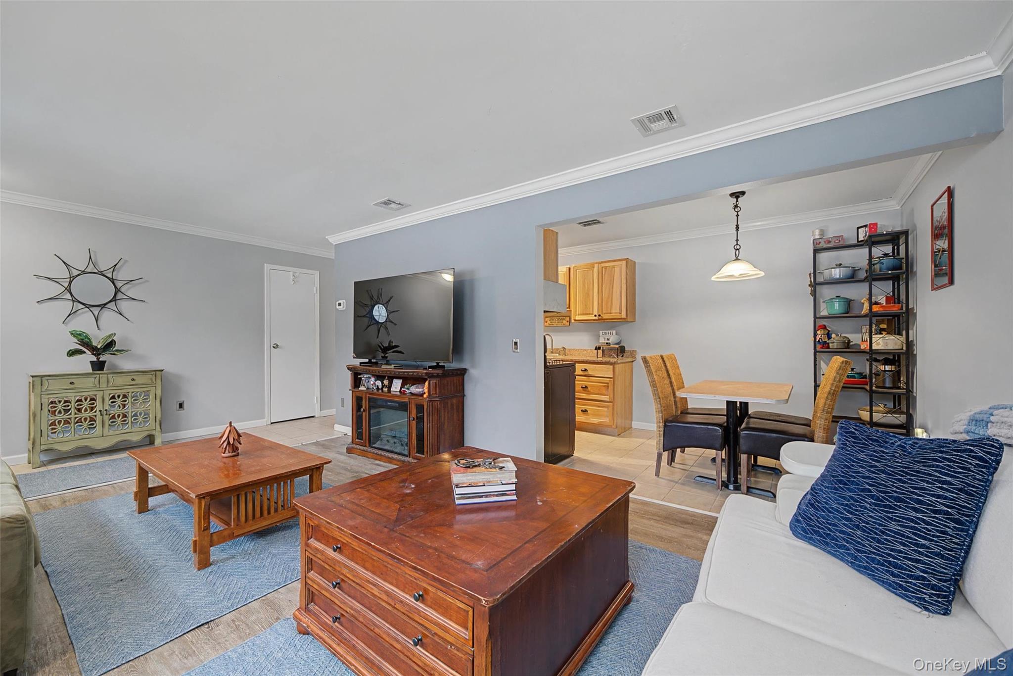 276 Temple Hill Road, Unit 1117 New Windsor, NY 12553 - Photo 6 of 24 a living room with furniture and wooden floor