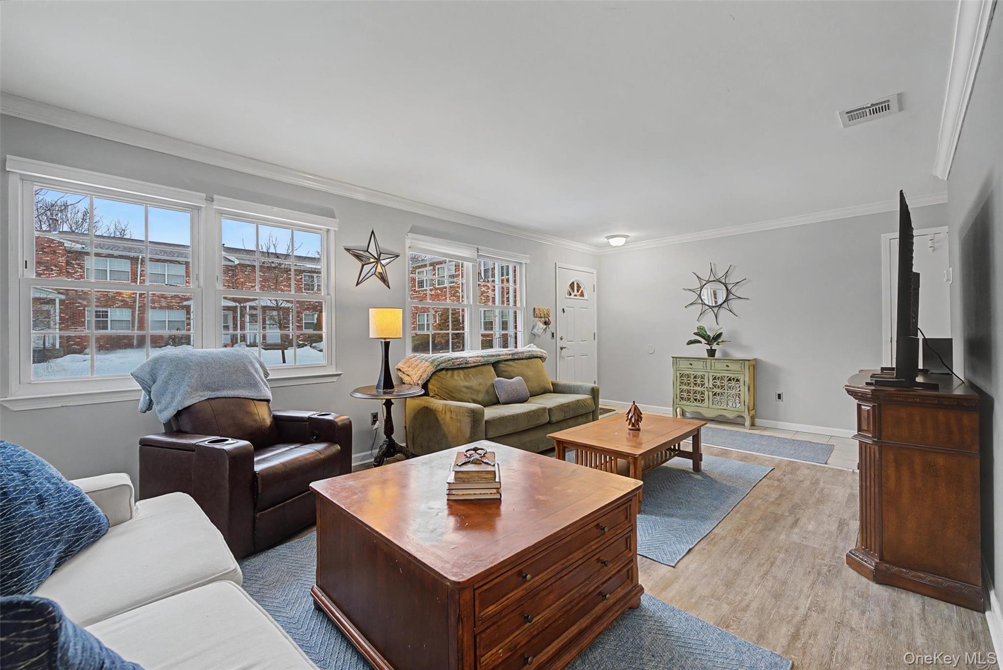 276 Temple Hill Road, Unit 1117 New Windsor, NY 12553 - Photo 7 of 24 a living room with furniture and a flat screen tv