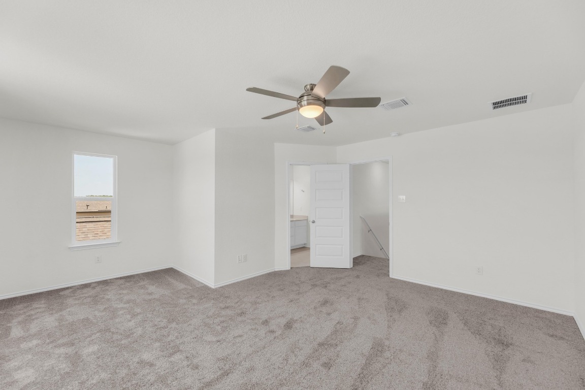 200 Lucky Texan Road Jarrell, TX 76537 - Photo 17 of 34 a view of a livingroom with a ceiling fan and window