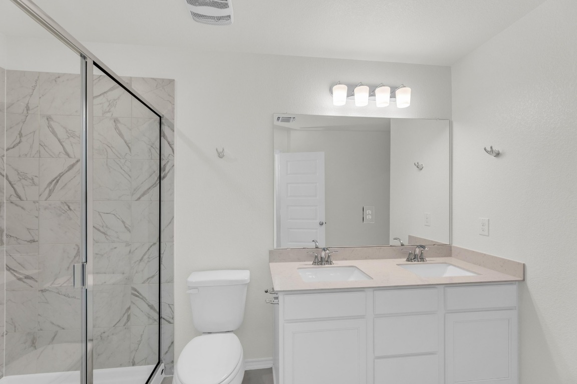 200 Lucky Texan Road Jarrell, TX 76537 - Photo 19 of 34 a bathroom with a sink toilet and shower