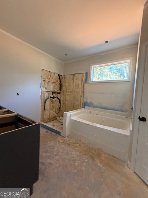 248 Robert Williams Road Pine Mountain, GA 31822 - Photo 27 of 46 a bathroom with a bathtub and a shower