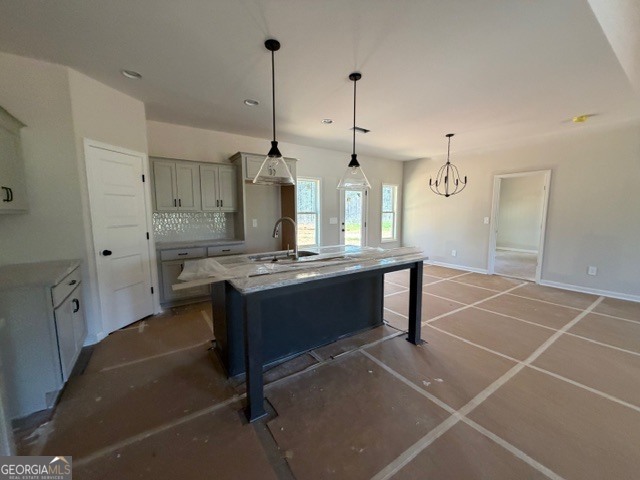 248 Robert Williams Road Pine Mountain, GA 31822 - Photo 10 of 46 a large kitchen with stainless steel appliances kitchen island granite countertop a table chairs in it and wooden floors