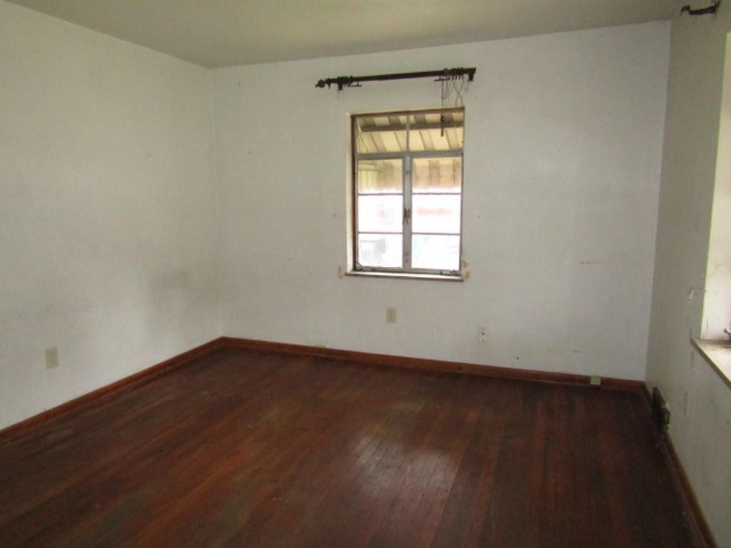 1353 Front Street Crescent, PA 15046 - Photo 7 of 22 an empty room with wooden floor and windows