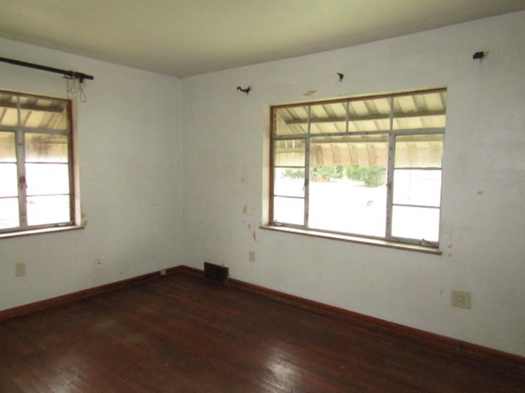 1353 Front Street Crescent, PA 15046 - Photo 8 of 22 an empty room with wooden floor and windows