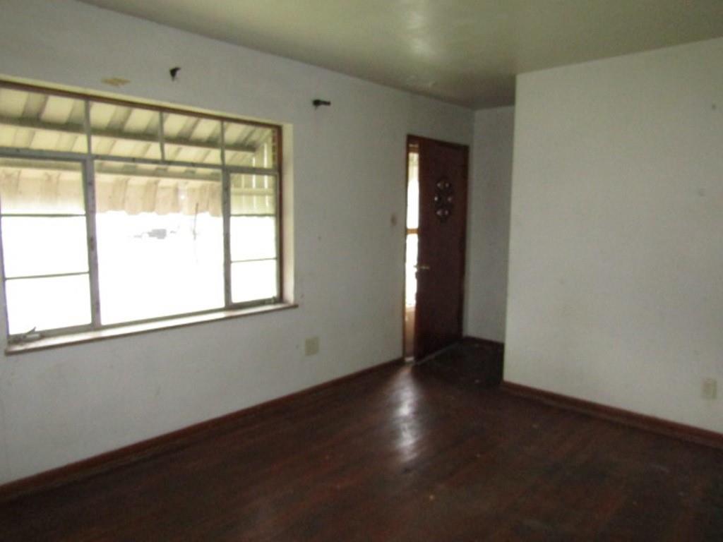 1353 Front Street Crescent, PA 15046 - Photo 9 of 22 an empty room with wooden floor and windows