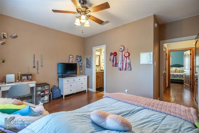 a bedroom with a bed and a view of bedroom