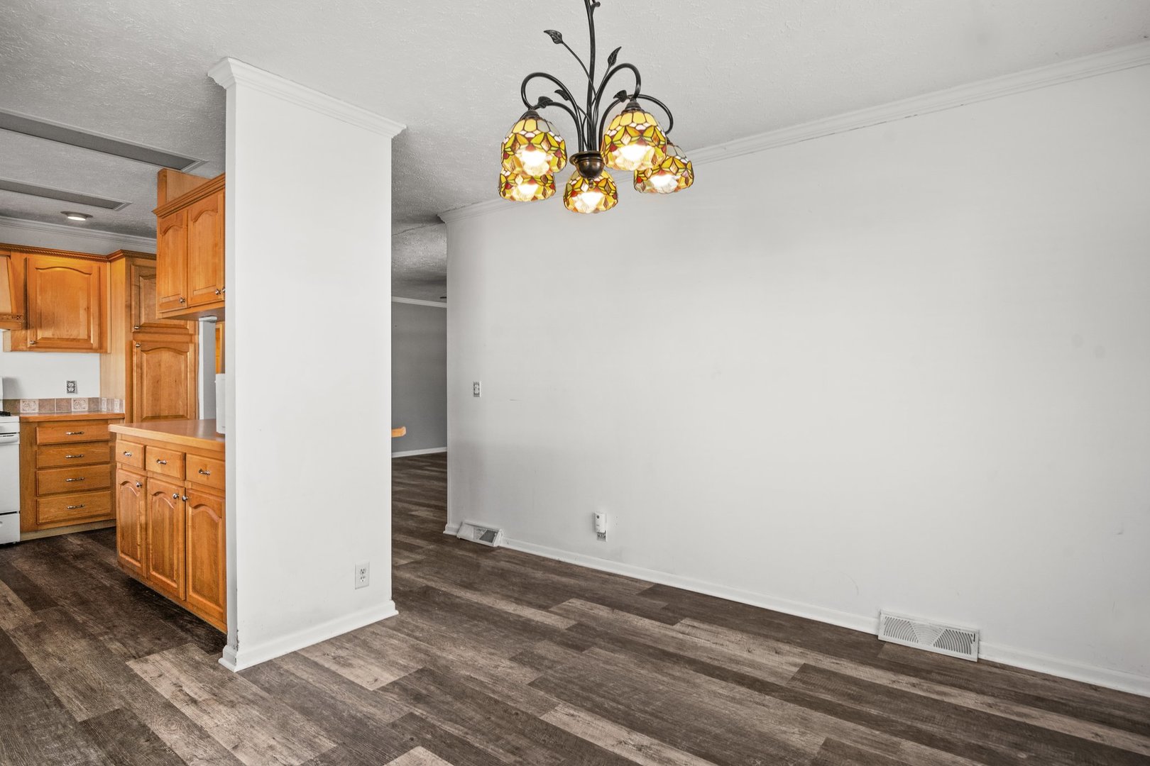 1119 Lakewood Road Elgin, IL 60123 - Photo 11 of 24 an empty room with wooden floor and windows