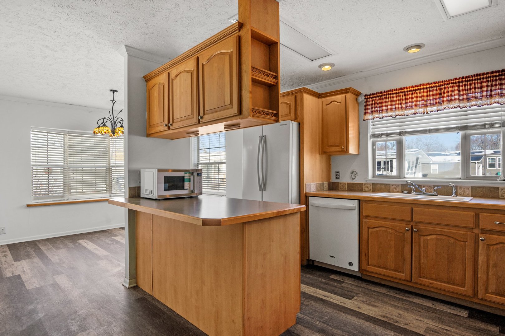 1119 Lakewood Road Elgin, IL 60123 - Photo 12 of 24 a kitchen with stainless steel appliances granite countertop a sink a stove and refrigerator