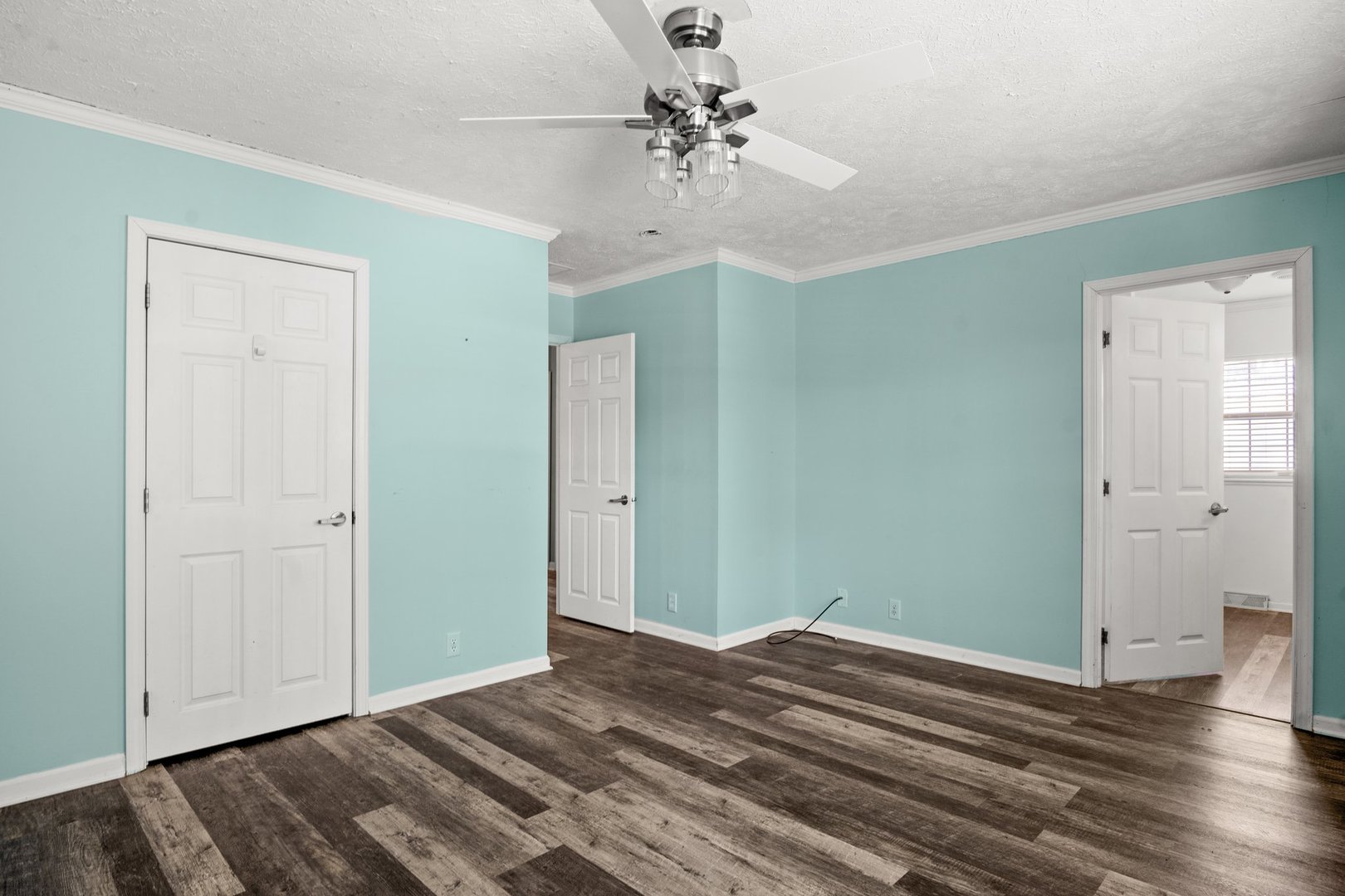 1119 Lakewood Road Elgin, IL 60123 - Photo 17 of 24 a view of a room with wooden floor and ceiling fan