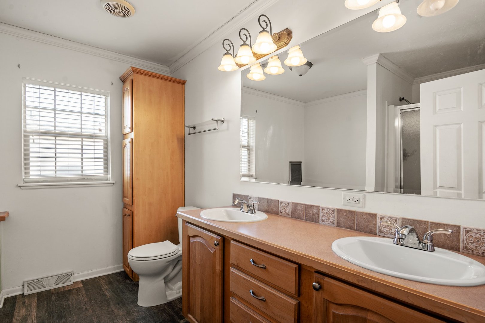 1119 Lakewood Road Elgin, IL 60123 - Photo 18 of 24 a bathroom with a granite countertop sink a toilet and a mirror