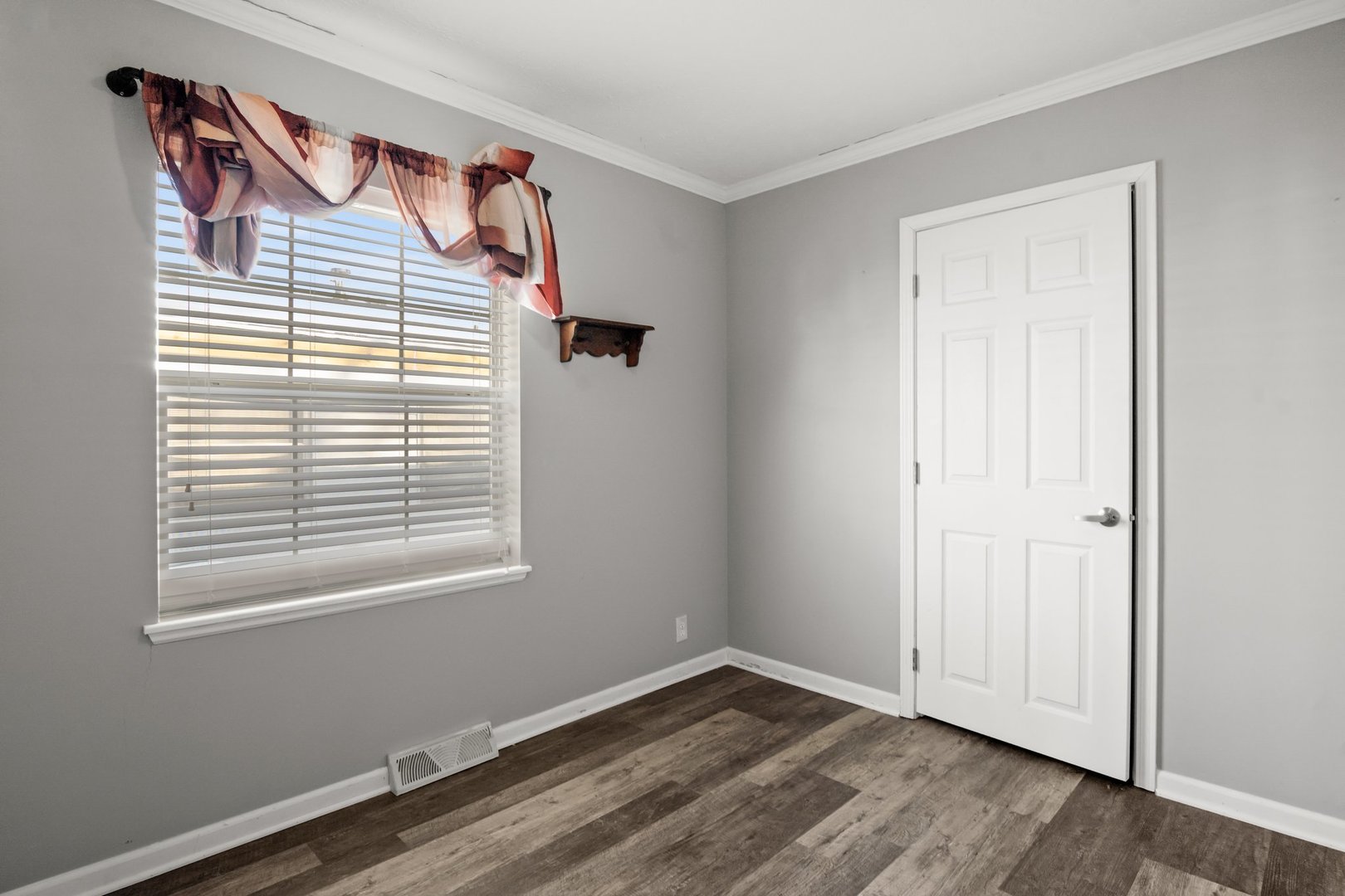 1119 Lakewood Road Elgin, IL 60123 - Photo 19 of 24 a view of a small space with wooden floor and a window
