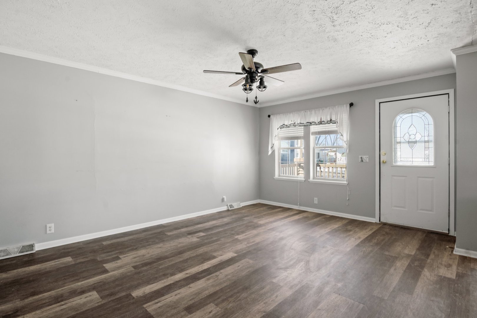 1119 Lakewood Road Elgin, IL 60123 - Photo 8 of 24 wooden floor in an empty room with a window