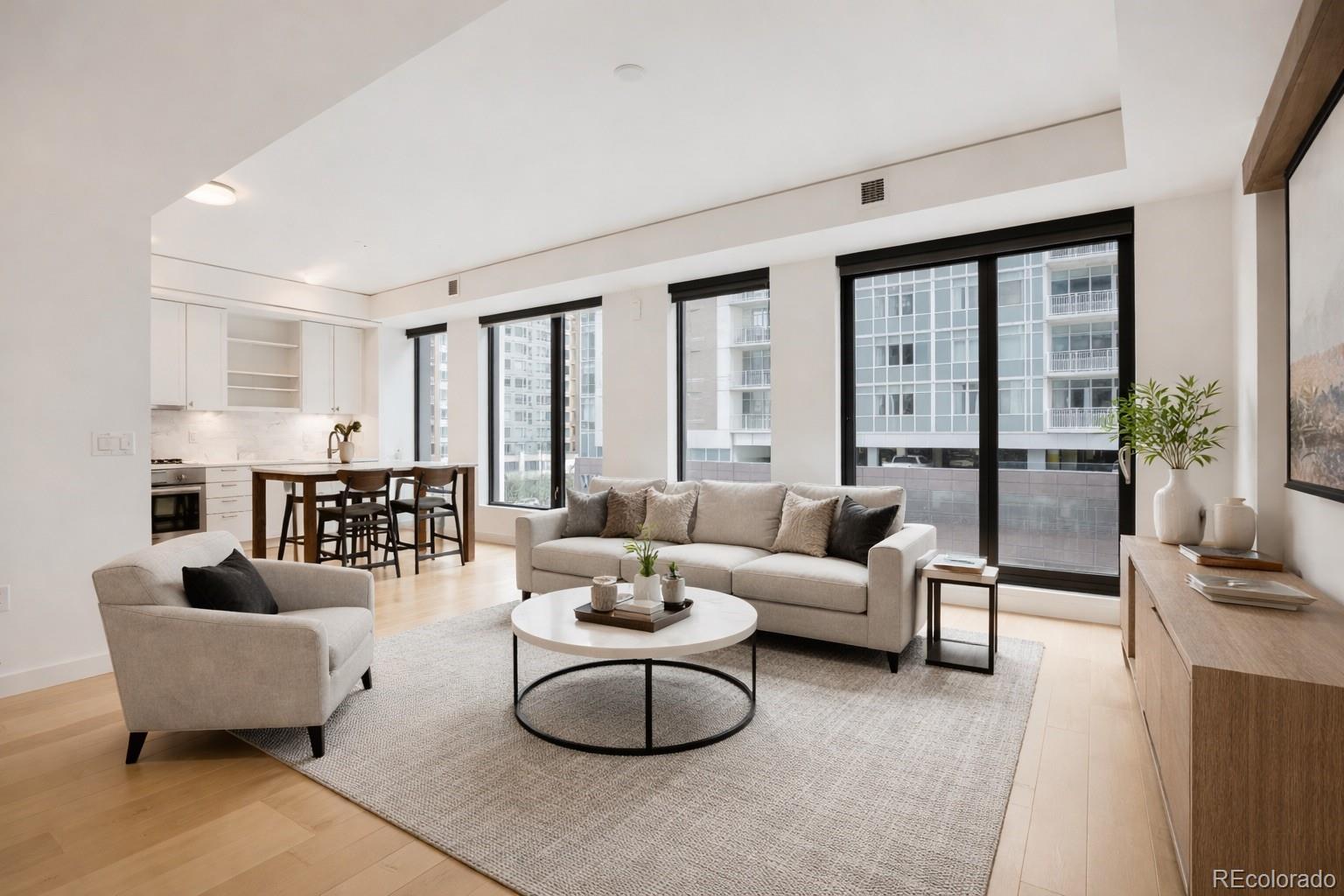 1750 Wewatta Street, Unit 403 Denver, CO 80202 - Photo 1 of 40 a living room with furniture and large windows